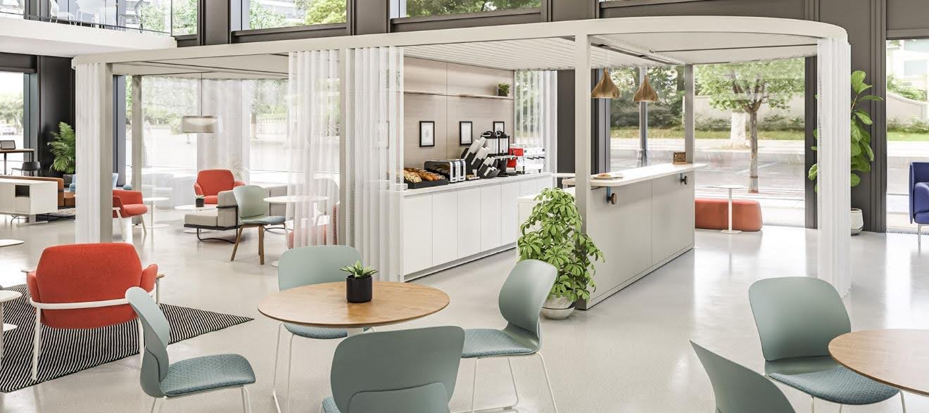 coin cafétéria avec table ronde à manger et fauteuils de détente